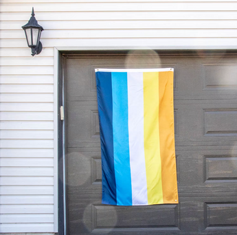 An Aroace flag with orange, yellow, white, light blue, and dark blue stripes symbolizing the aroace and LGBTQ+ community.